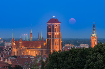 Naklejka premium Gdansk, Poland, night view of the historical city center with St Mary's church
