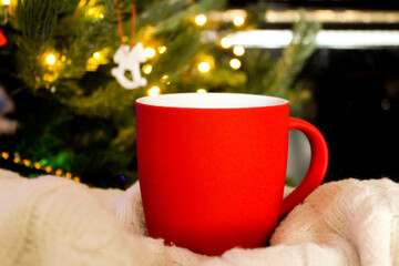 Blank red mug with christmas tree and piano on background,mat tea or coffee cup with christmas and new year decoration,horizontal mock up with ceramic mug for hot drinks,empty gift print template.