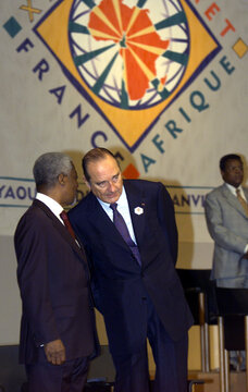 French President Jacques Chirac (R) listens to UN General Secretary Kofi Anan prior to the  opening ..
