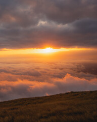 sunset in the mountains with sea of clouds