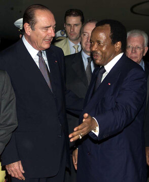 French President Jacques Chirac (L) listens to Cameroon President Paul Biya (R) as Chirac arrives in..