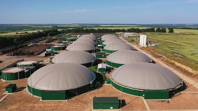 Innovative storage tanks for bio gas. Up-to-date plant for producing renewable energy from biomass. Aerial perspective.