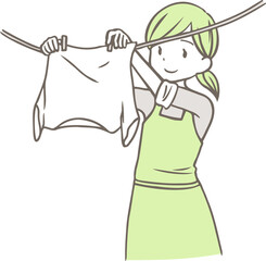 洗濯物を干す女性