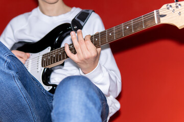 Fototapeta na wymiar Young man playing electric guitar. Music, instrument education, entertainment, rock star, music concert and learning concept