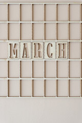 the month "march" in stencil font on paper