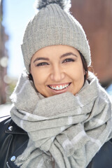 Merry young female in knitted hat