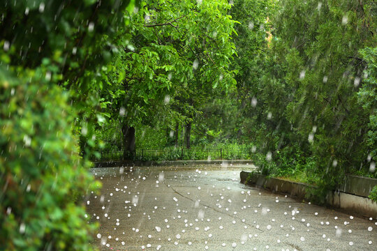 View of city street on rainy day with hail