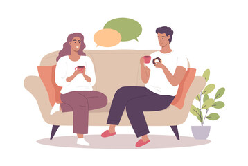 Young couple woman and man drinking coffee on the sofa at home