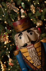 Wooden Nutcracker in front of a decorated Christmas tree during the holidays in Wisconsin