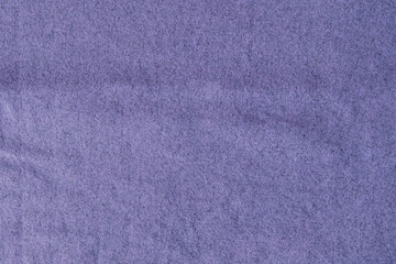 Wrinkled textured surface of purple wool knitted fabric
