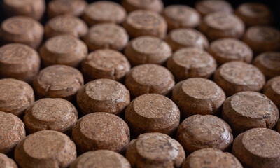 corks from wine and champagne in the same plane a lot in perspective very close in details background pattern macro
