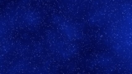 Beautiful snow falling on an abstract blue sky background. Winter holiday concept.