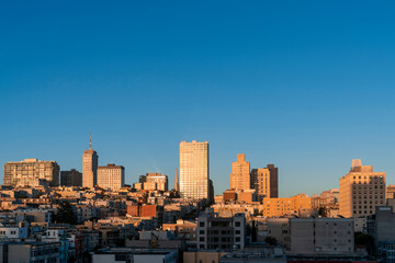 Fototapeta na wymiar Panoramic cityscape view of San Francisco Nob hill area, which is historically known as a center of San Francisco upper class neighborhoods at golden hour, sunset, midtown, California, United States.