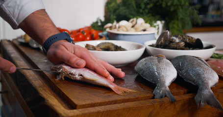 Cleaning Fish Before Cooking. Sea Food.