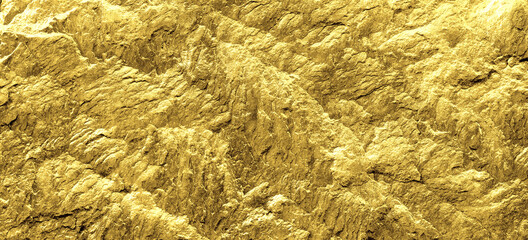 Gold grunge background. Gold stone background with copy space.