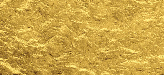 Gold grunge background. Gold stone background with copy space.