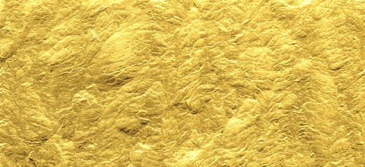 Gold grunge background. Gold stone background with copy space.