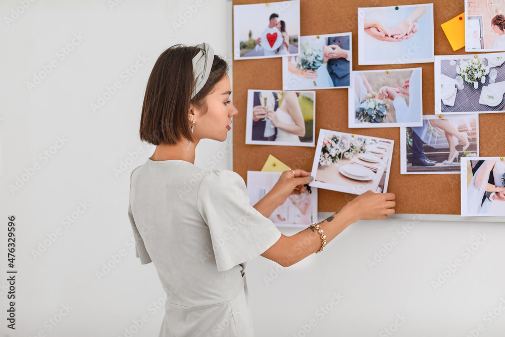 Wall mural female wedding planner working in office