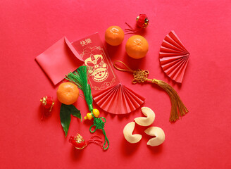 Red envelopes with Chinese symbols on color background. New Year celebration