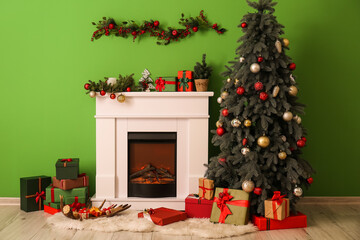 Fireplace with beautiful decorations and Christmas tree in living room