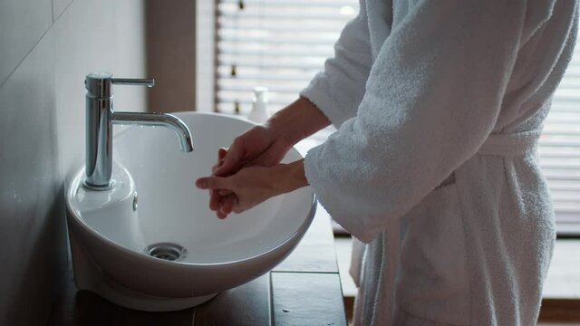 Unrecognizable Asian Woman Washing Hands With Soap In Bathroom, Cropped