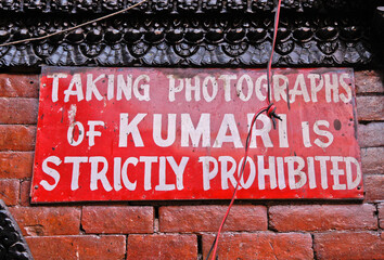 Kathmandu, Nepal: A sign in the courtyard of Kumari Chowk, residence of the Kumari (Living Goddess) in Kathmandu's Durbar Square, prohibits taking photos of the Kumari