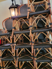 Stacked bistro chairs and French outdoor light 