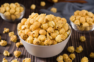 popcorn in a bow  on wood background