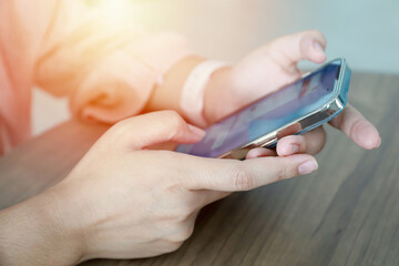 Close up women using mobile smartphone