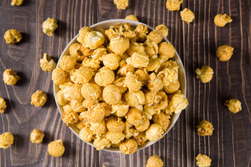 popcorn in a bow  on wood background