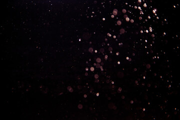 Abstract bokeh of light texture with black background