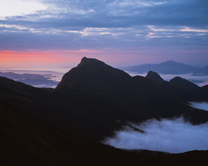 Wallpaper of mountains at blue hour with pink light