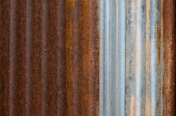 Close-up sheet of zinc for roofing with rusted and weathered. Vertical curve lines for backgrounds.