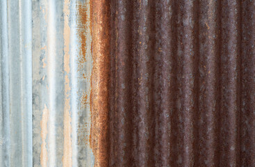 Close-up sheet of zinc for roofing with rusted and weathered. Vertical curve lines for backgrounds.