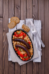 Braised beans with vegetables and fried sausages