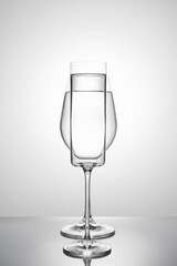 Two glasses of different shapes on a white background.