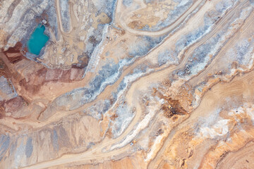 Sand quarry from a great height, beautiful orange patterns on the rocks
