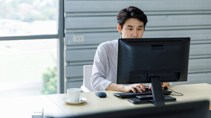 Asian happy male corporate receptionist operator service support employee staff wearing headset adjusting microphone when discussing talking helping having conversation with clients customers online