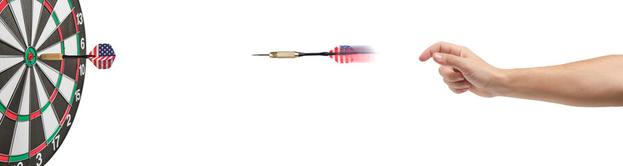 Hand throwing darts straight into center of dartboard.Concept of competition and goal...