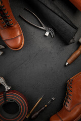 Top view on leather cobbler shoe crafting workshop place with tools