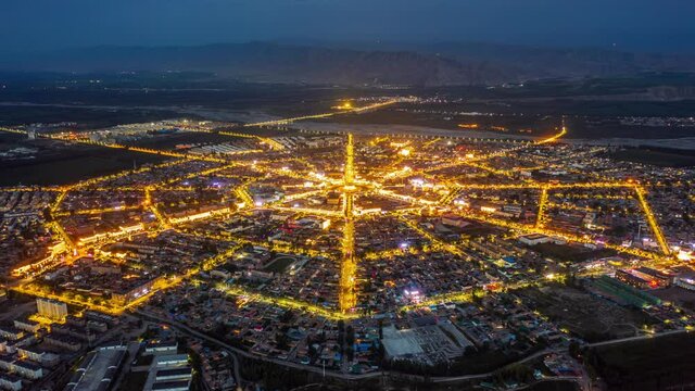 Aerial view of Tex Gossip City at night in Xinjiang, China.