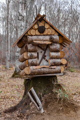 fairy house.a dollhouse made of logs. A miniature hut in the forest.