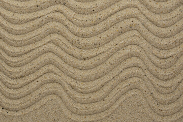 Zen sand garden meditation stone background with copy space. Stones and lines drawing in sand for relaxation. Concept of harmony, balance and meditation, spa, massage, relax