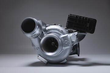New metal turbocharger. Exhaust gas blower. Parts background © yanik88