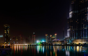 Fototapeta na wymiar night view of Dubai, tall buildings of uae, skyscrapers of united Arab emirates 