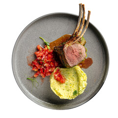 Rack of lamb with mashed potatoes on wooden background