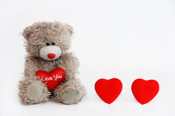 soft toy bear holding a red heart