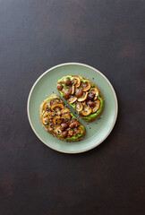 Bruschetta with mushrooms and avocados. Healthy eating. Vegetarian food. Keto diet.