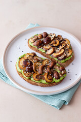 Bruschetta with mushrooms and avocados. Healthy eating. Vegetarian food. Keto diet.