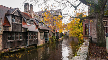 historic center with brick houses in the Belgian city of Bruges  - 476369360
